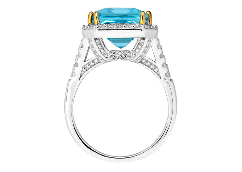 Sterling Silver 8 Carat Blue Topaz Emerald Cut Ring with 18 KGP Prongs by Bling