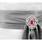 Silver Ornate Regal Brooch with Ruby Red Center Stone and 18 KGP Prongs by Bling